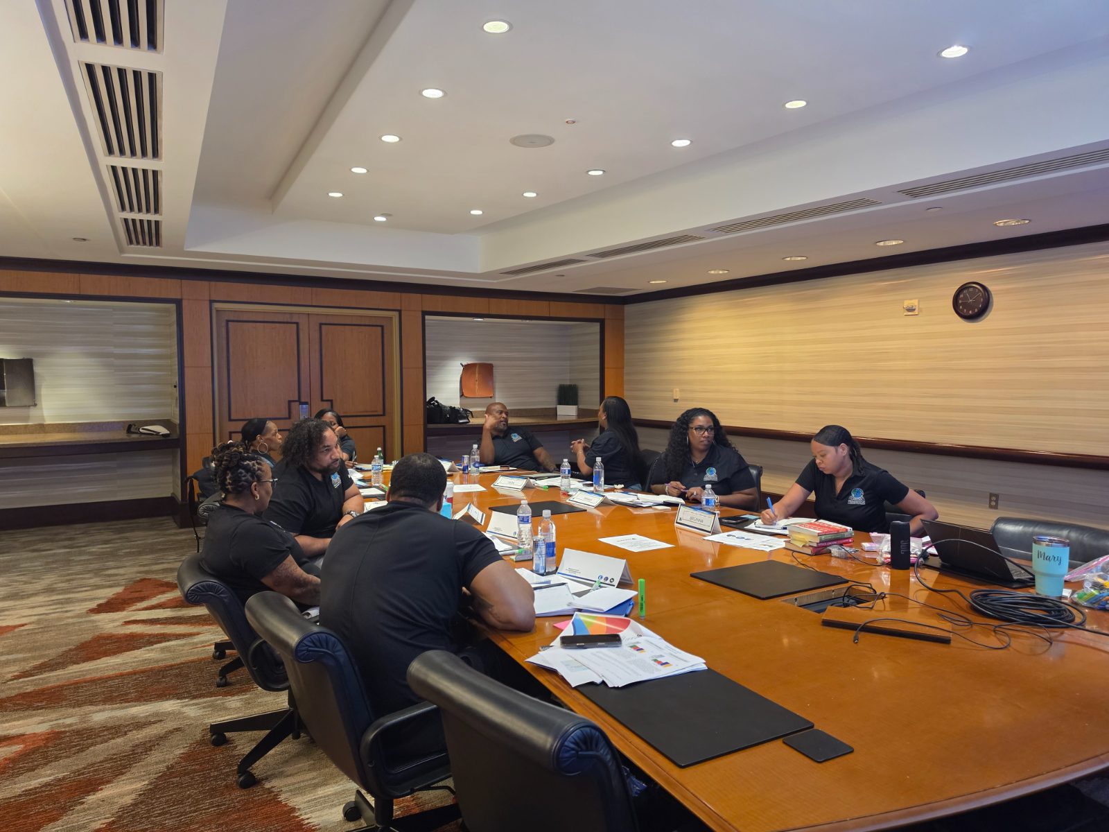 Professionals participating in a facilitated organizational leadership session.